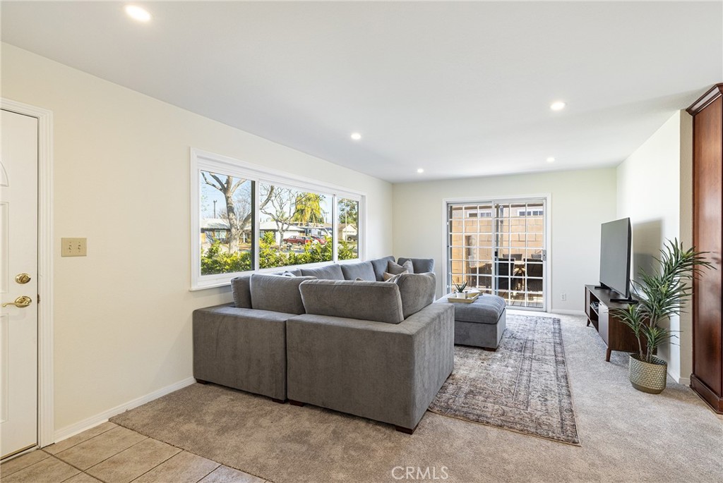 2206 Stinson Street Simi Valley, CA 93065 - Photo 5 of 22 a living room with furniture and a flat screen tv