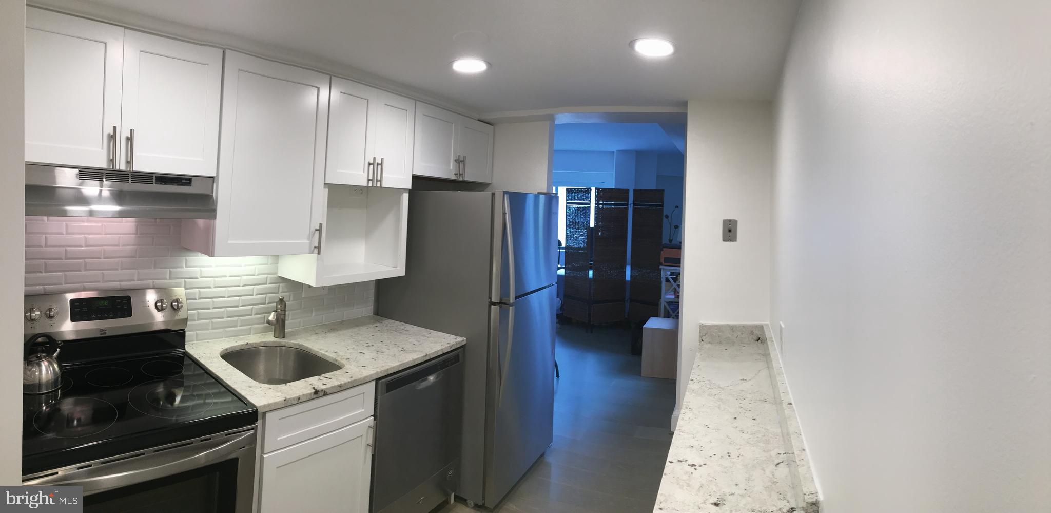 1825 T Street Northwest, Unit 303 Washington, DC 20009 - Photo 2 of 16 Galley kitchen with full size appliances