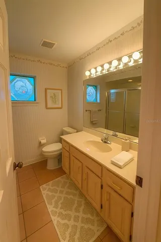 a view of a kitchen with a sink and a stove top oven