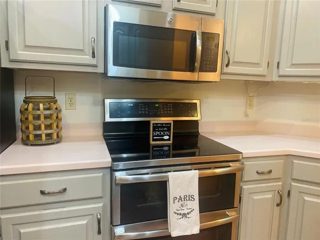 a view of room with window and wooden floor