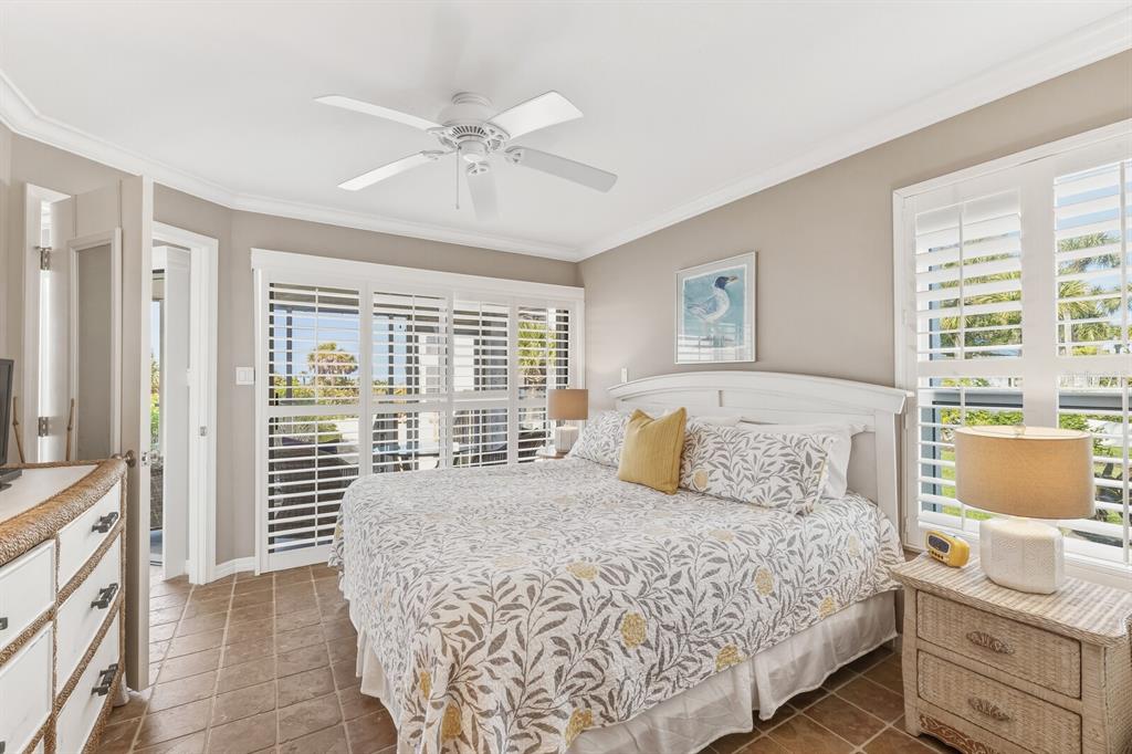 5000 Gasparilla Road, Unit DC107 Boca Grande, FL 33921 - Photo 9 of 30 a bedroom with a large bed and a window