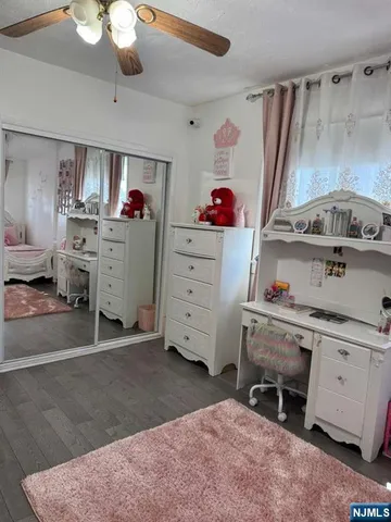 a view of a kitchen with fridge and workspace