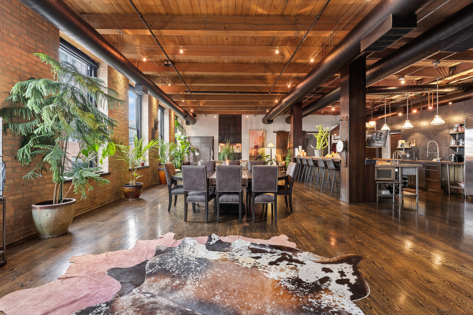 1101 West Lake Street, Unit 5E Chicago, IL 60607 - Photo 14 of 38 a living room with lots of furniture and a potted plant