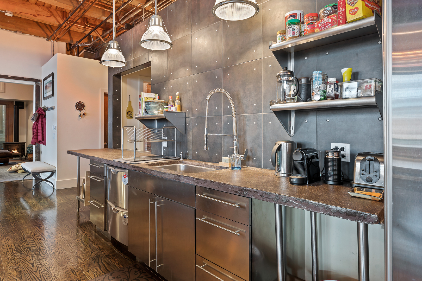 1101 West Lake Street, Unit 5E Chicago, IL 60607 - Photo 19 of 38 a kitchen with stainless steel appliances granite countertop a sink and cabinets