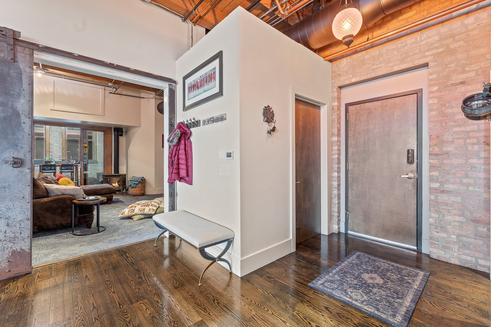 1101 West Lake Street, Unit 5E Chicago, IL 60607 - Photo 2 of 38 a living room with furniture and a rug