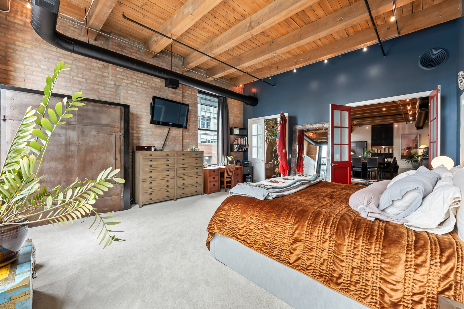 1101 West Lake Street, Unit 5E Chicago, IL 60607 - Photo 28 of 38 a bed room with a bed and a walk in closet