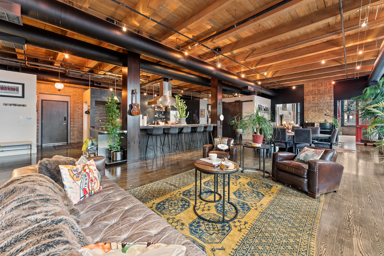 1101 West Lake Street, Unit 5E Chicago, IL 60607 - Photo 4 of 38 a outdoor living space with furniture and a black umbrella