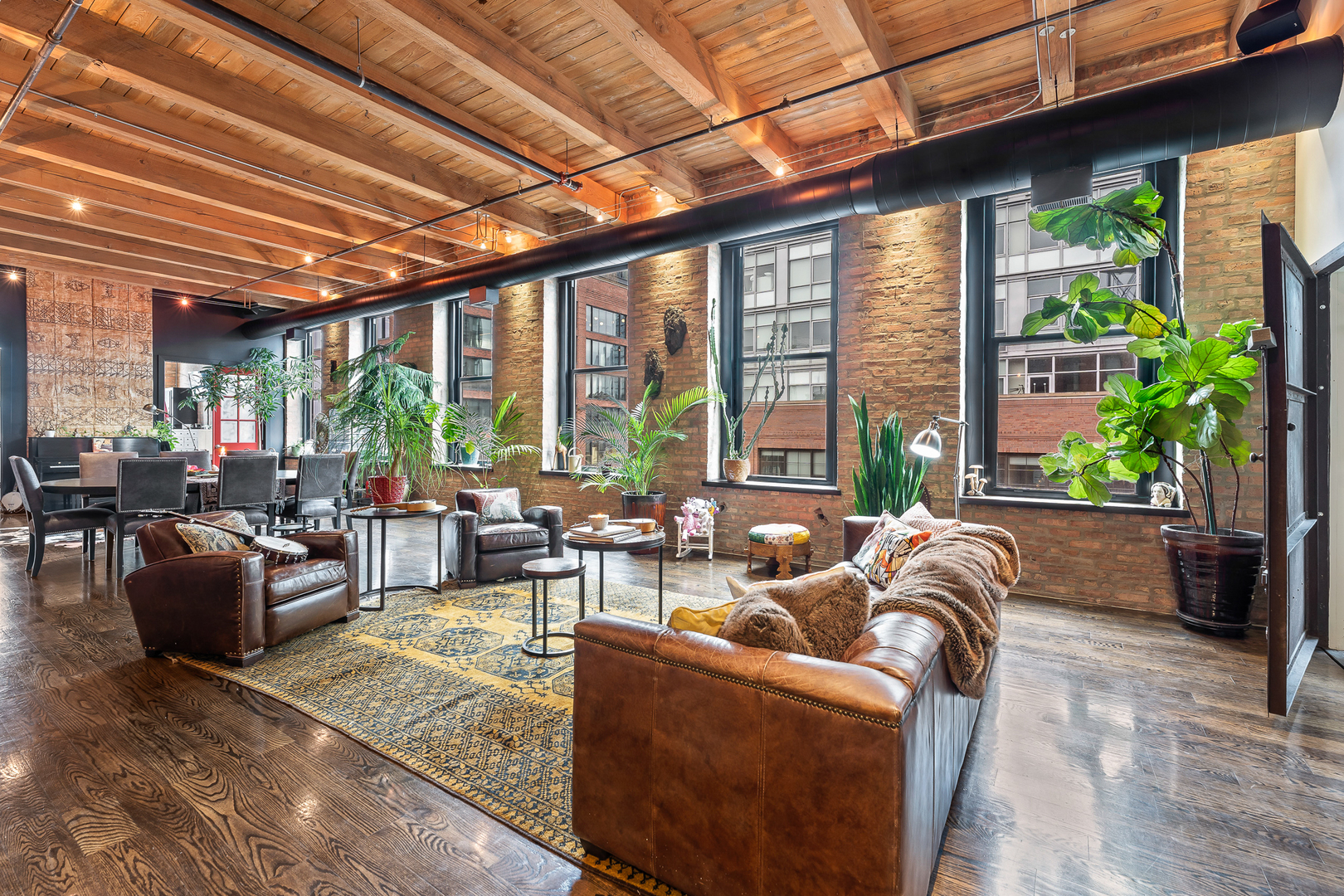 1101 West Lake Street, Unit 5E Chicago, IL 60607 - Photo 5 of 38 a living room with furniture and a large window