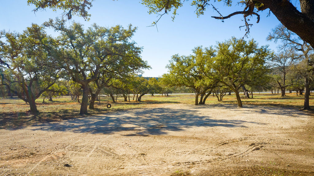 268 Kinnikinik Loop Austin, TX 78737 - Photo 17 of 23 a view of a yard with trees
