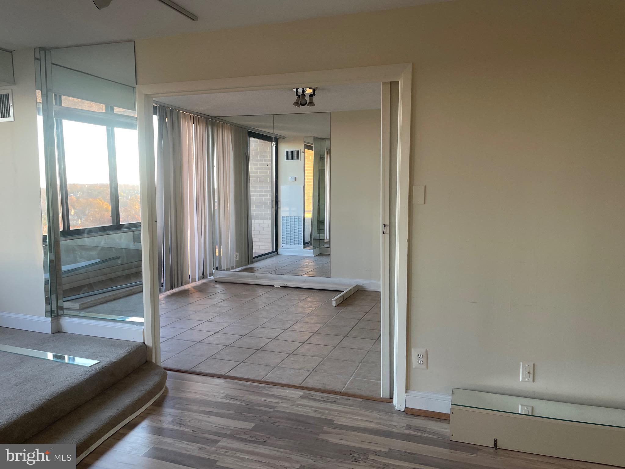 5225 Pooks Hill Road, Unit 1824N Bethesda, MD 20814 - Photo 2 of 50 a view of a hallway to an empty room and window