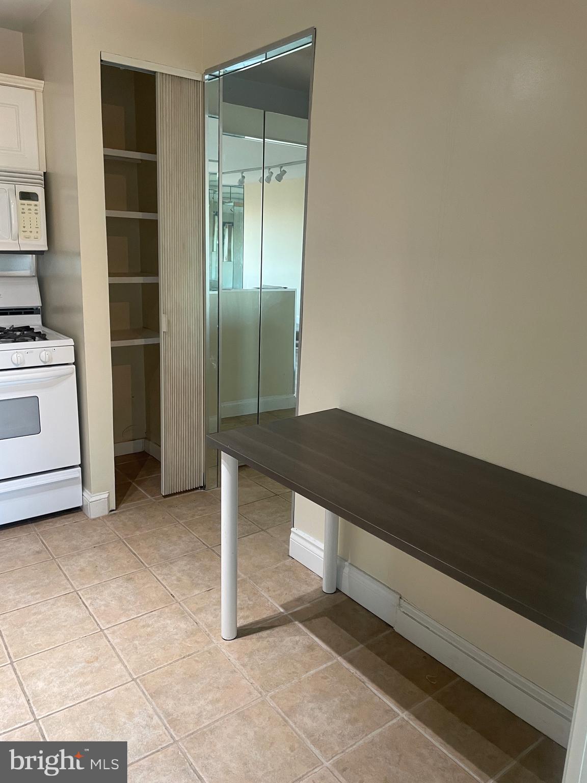 5225 Pooks Hill Road, Unit 1824N Bethesda, MD 20814 - Photo 5 of 50 a view of kitchen with a sink and dishwasher a oven with white cabinets