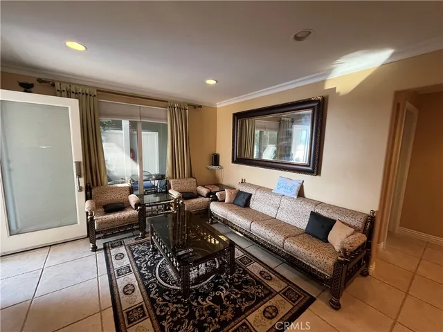 a kitchen with stainless steel appliances kitchen island granite countertop a refrigerator and a stove