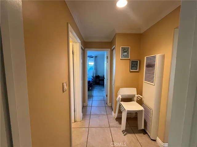 a view of a hallway with living room and furniture