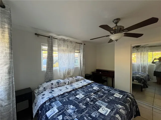 a bathroom with a sink mirror vanity and toilet