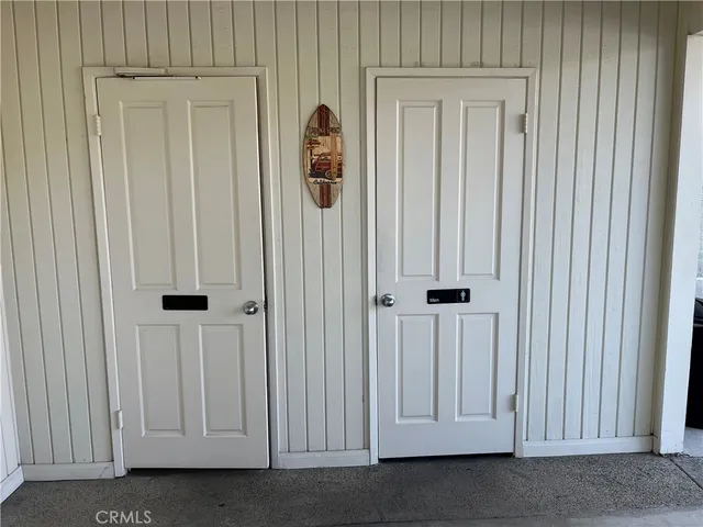 a view of an outdoor space with furniture and umbrella