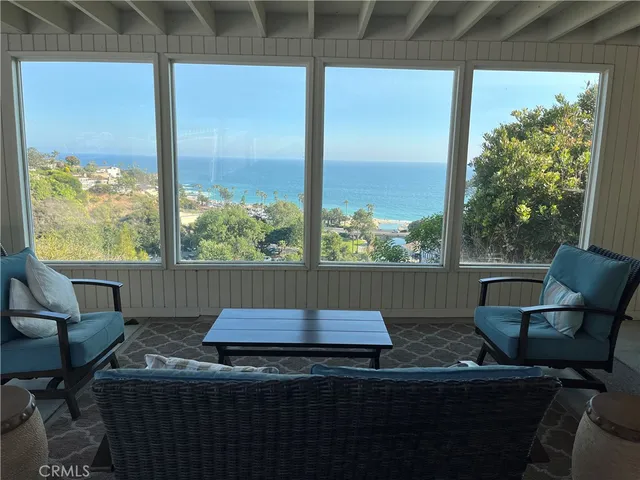 a room with water heater and a cabinet
