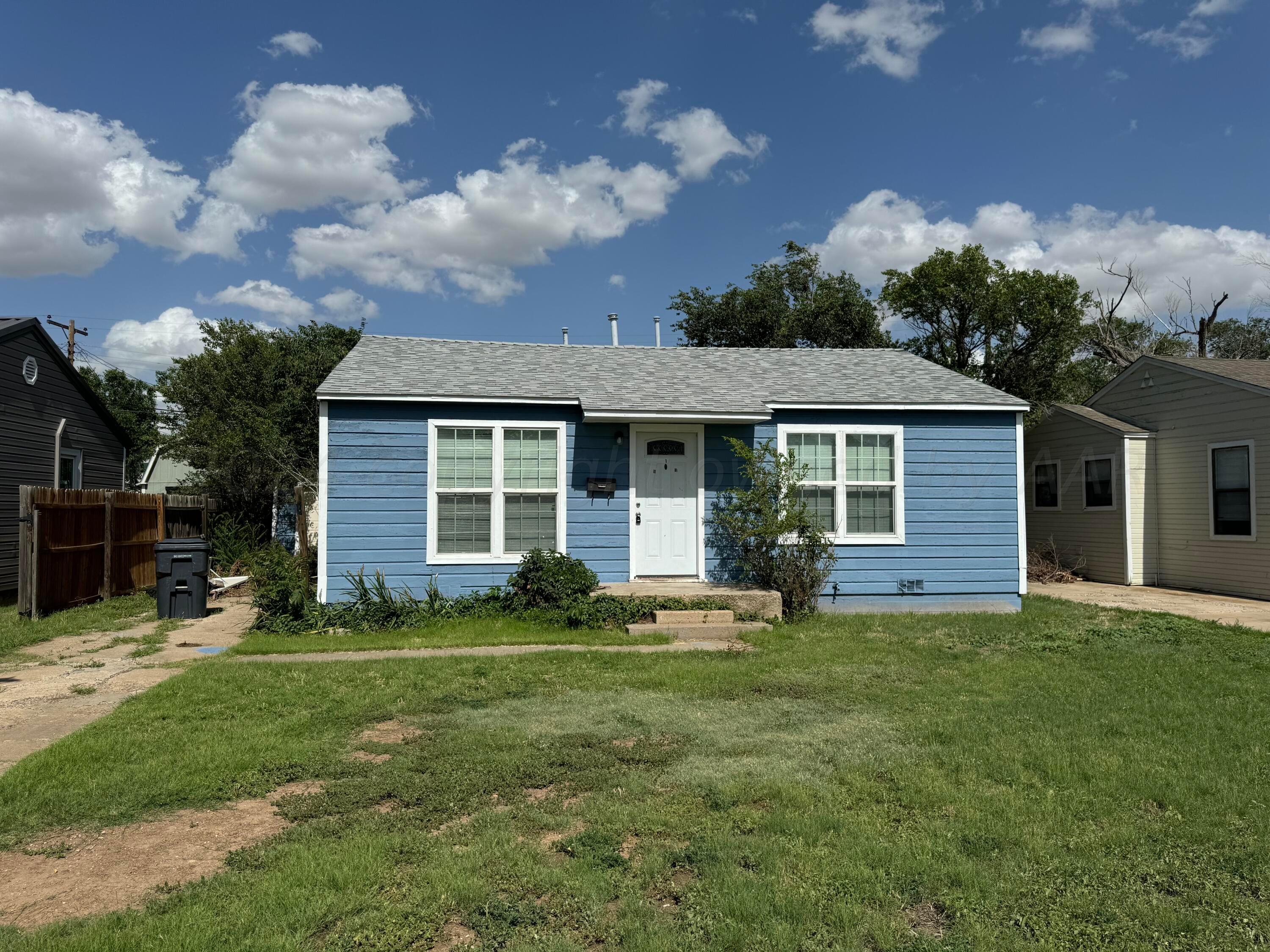 4119 Parker Street Amarillo, TX 79110 - Photo 1 of 9 front view of a house with a yard
