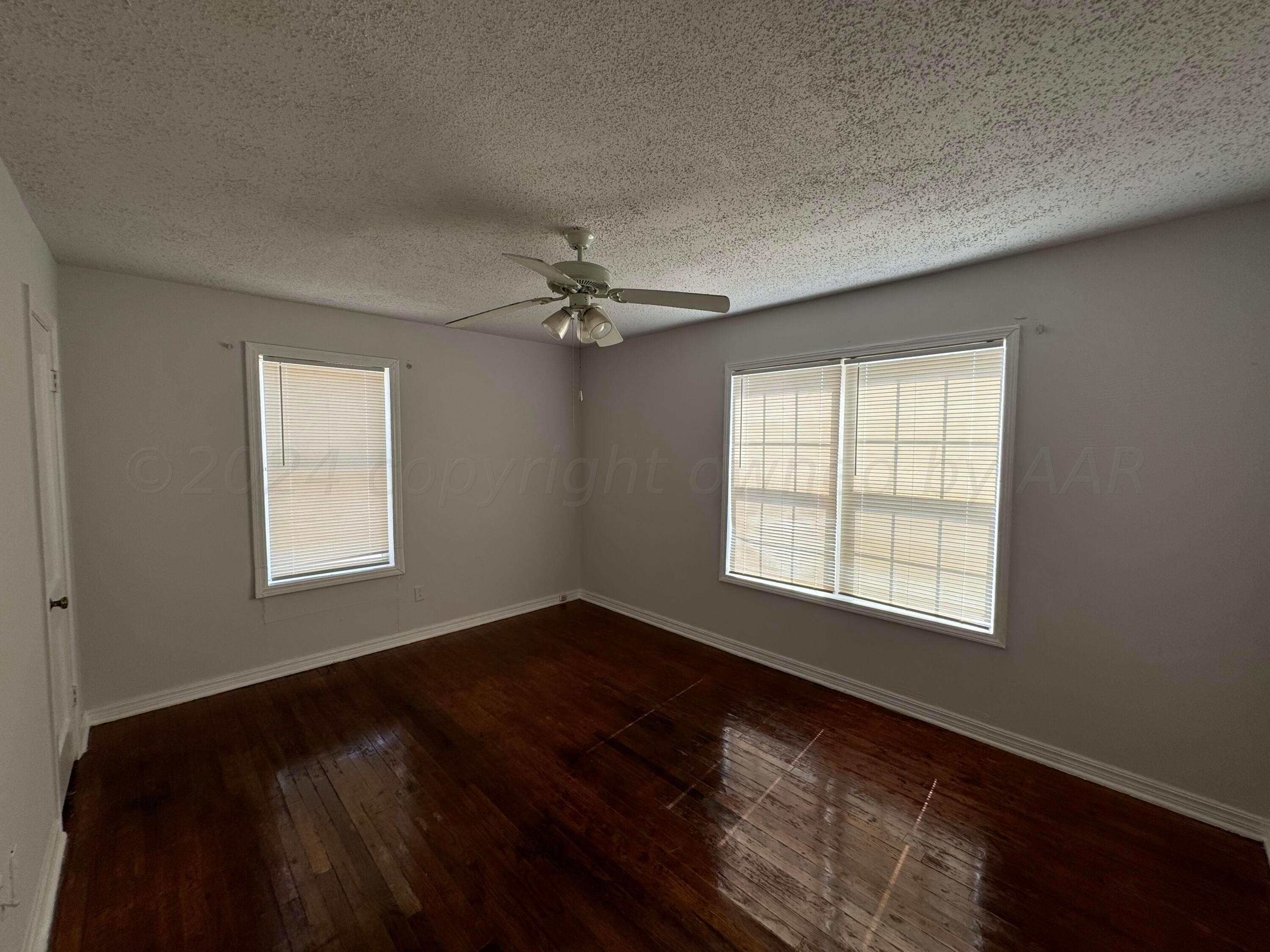4119 Parker Street Amarillo, TX 79110 - Photo 6 of 9 a view of an empty room with a window