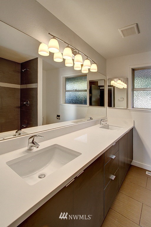 24320 4th Place West Bothell, WA 98021 - Photo 14 of 24 a bathroom with a sink double vanity and a mirror