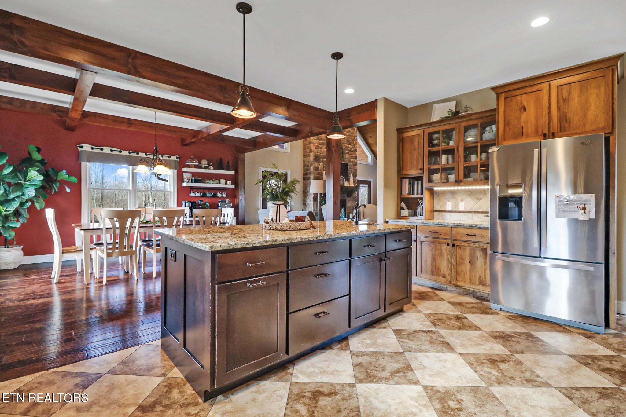 370 Randolph Road Crossville, TN 38571 - Photo 20 of 60 a kitchen with stainless steel appliances granite countertop a refrigerator a stove and a wooden floors