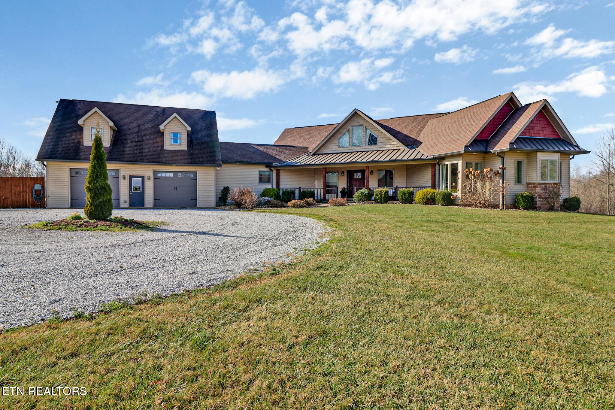 370 Randolph Road Crossville, TN 38571 - Photo 2 of 60 a front view of a house with yard and porch