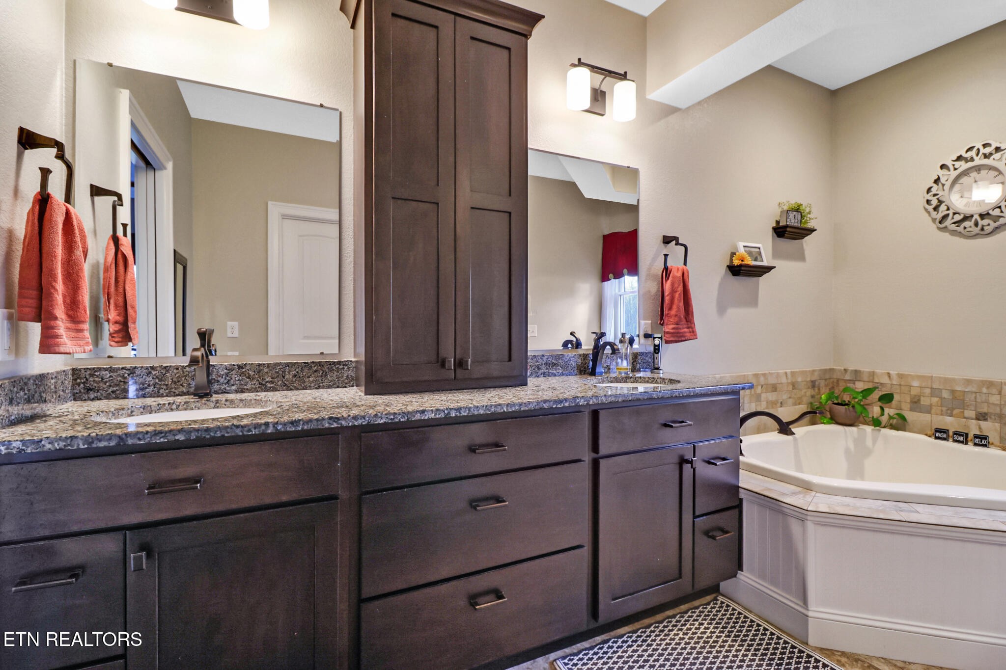 370 Randolph Road Crossville, TN 38571 - Photo 25 of 60 a bathroom with a tub sink and mirror