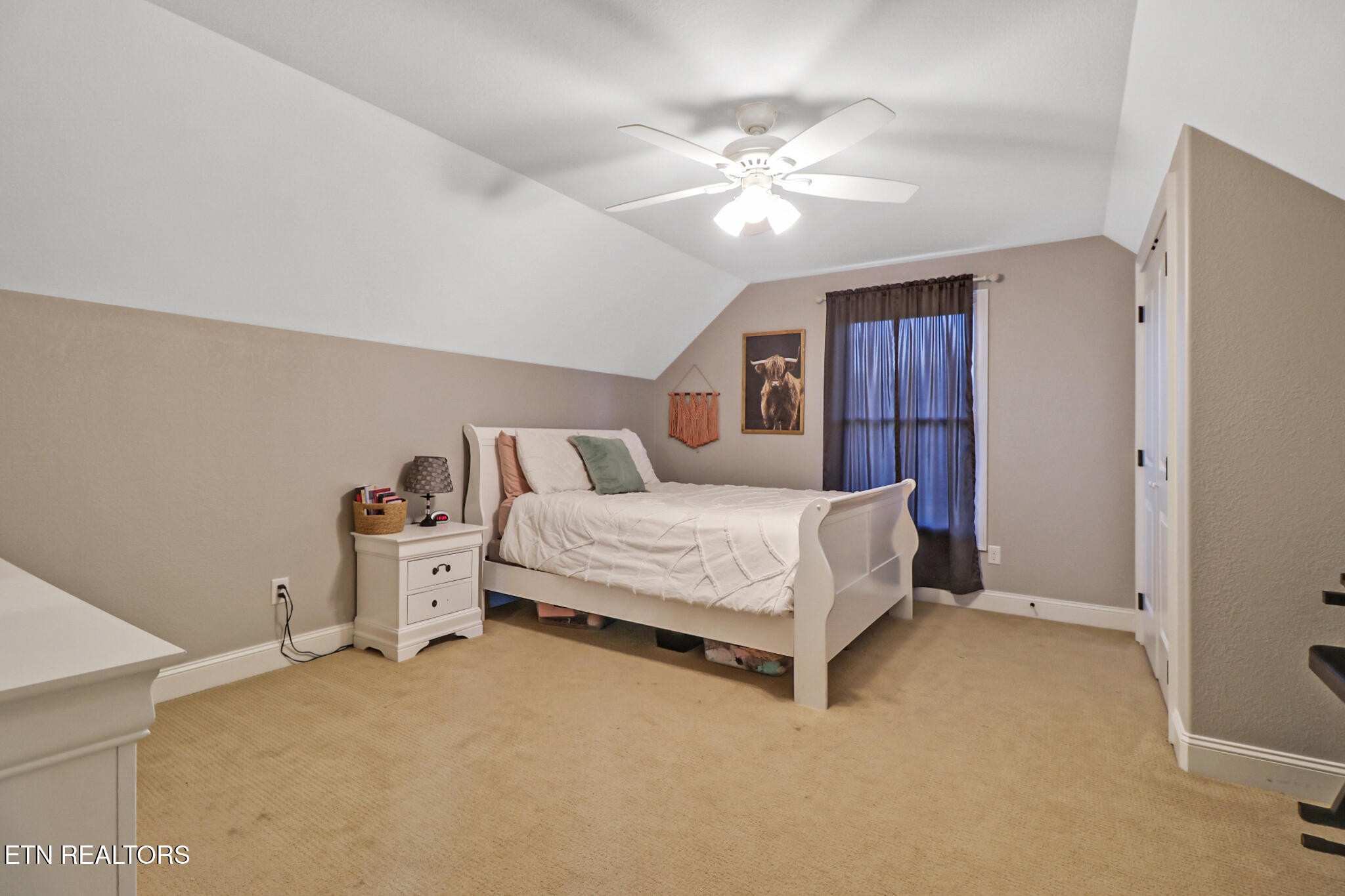 370 Randolph Road Crossville, TN 38571 - Photo 35 of 60 a bedroom with a bed and a chandelier