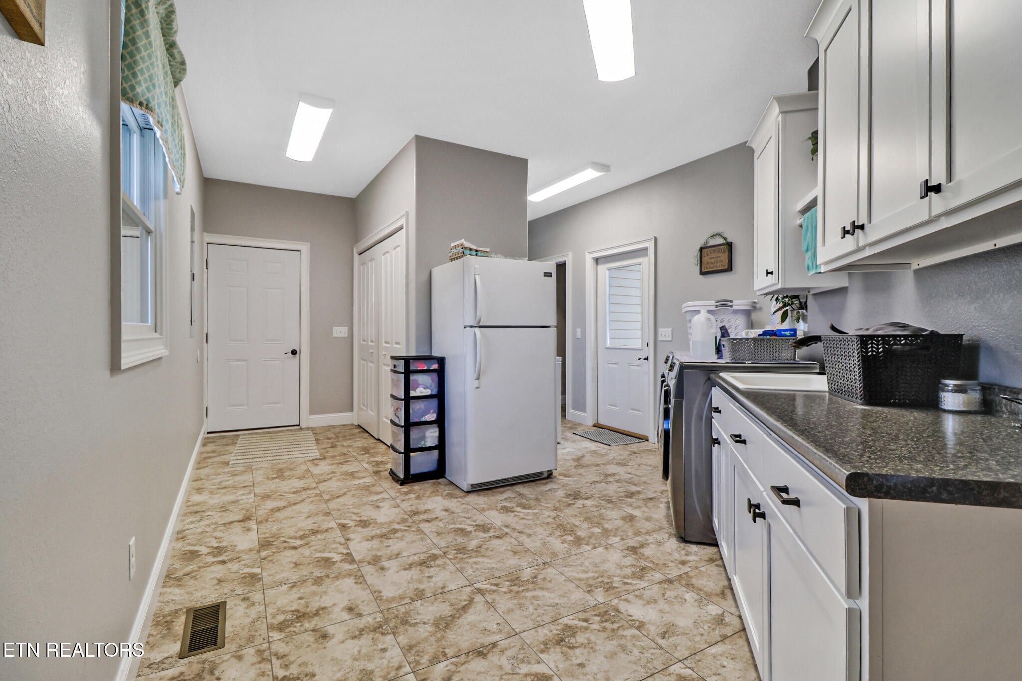 370 Randolph Road Crossville, TN 38571 - Photo 37 of 60 a kitchen with a refrigerator and a sink