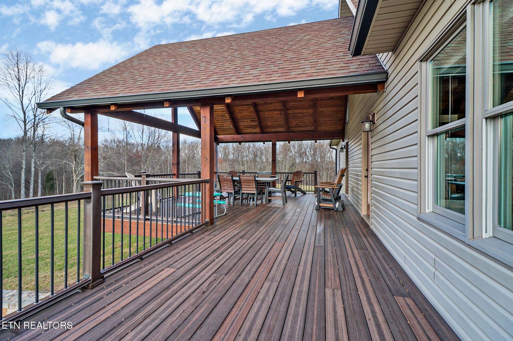 370 Randolph Road Crossville, TN 38571 - Photo 51 of 60 a balcony with wooden floor table and chairs