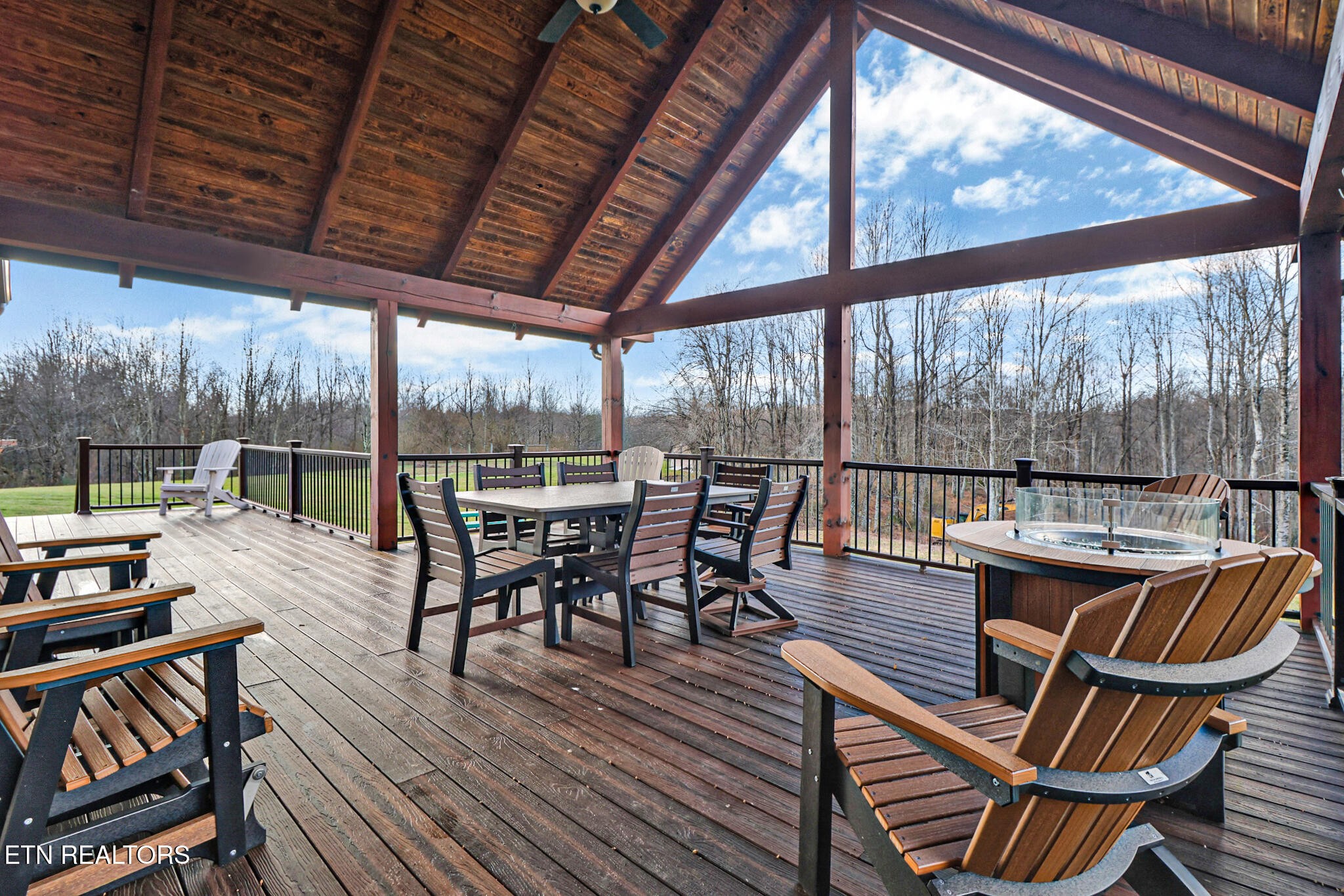 370 Randolph Road Crossville, TN 38571 - Photo 52 of 60 a view of a patio with wooden floor a yard tables and chairs