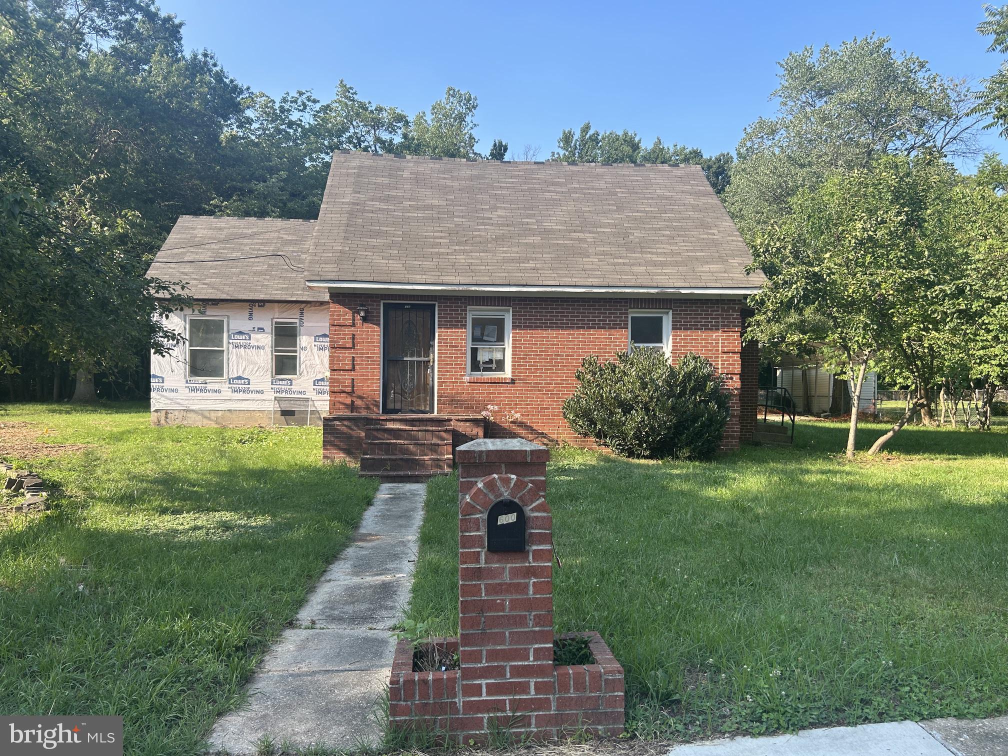 6600 Woodland Road Morningside, MD 20746 - Photo 1 of 7 Charming brick home with lush greenery.