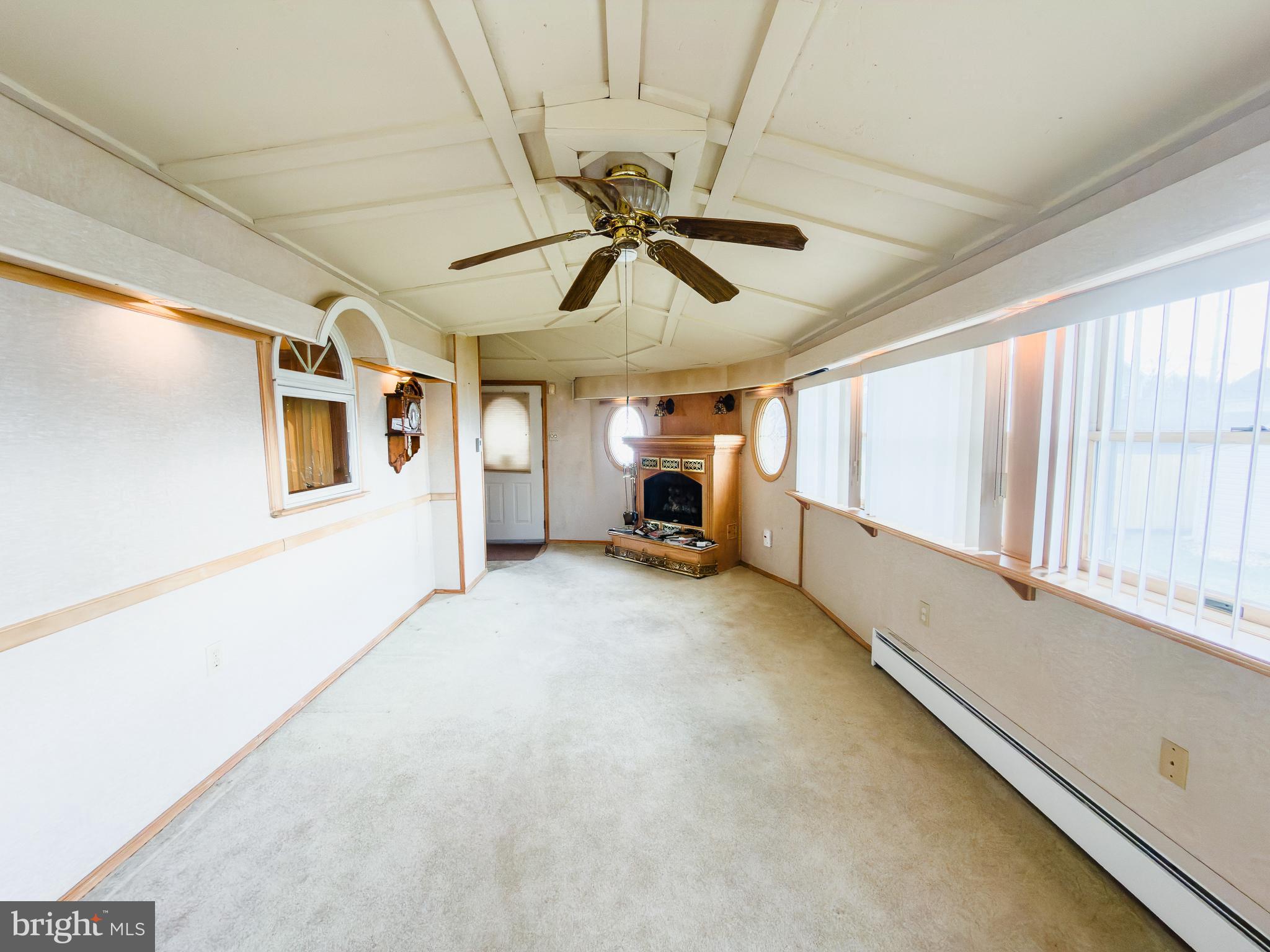 440 Durham Road Langhorne, PA 19047 - Photo 15 of 23 a view of a livingroom with furniture chandelier fan and windows