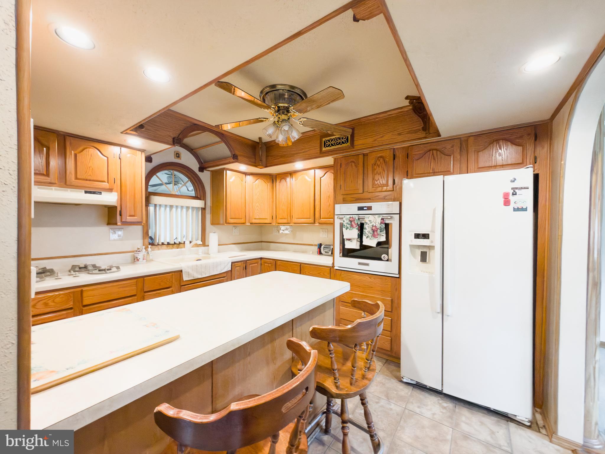 440 Durham Road Langhorne, PA 19047 - Photo 10 of 23 a kitchen with a refrigerator a sink and cabinets
