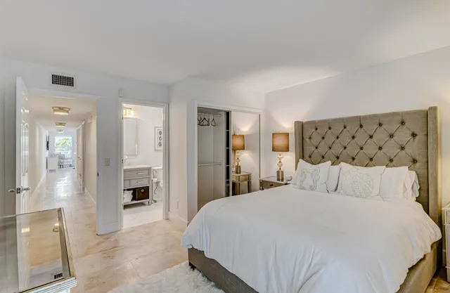 a bathroom with a sink mirror and toilet
