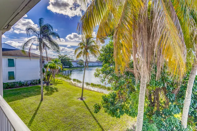 a view of a lake with houses in the back