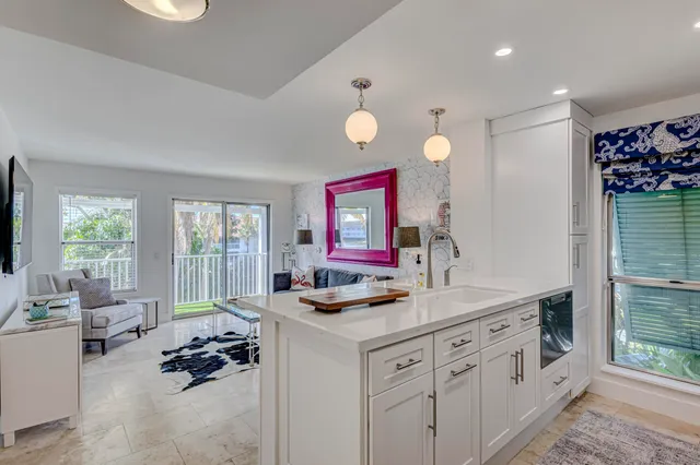 a kitchen that has cabinets stove and a table