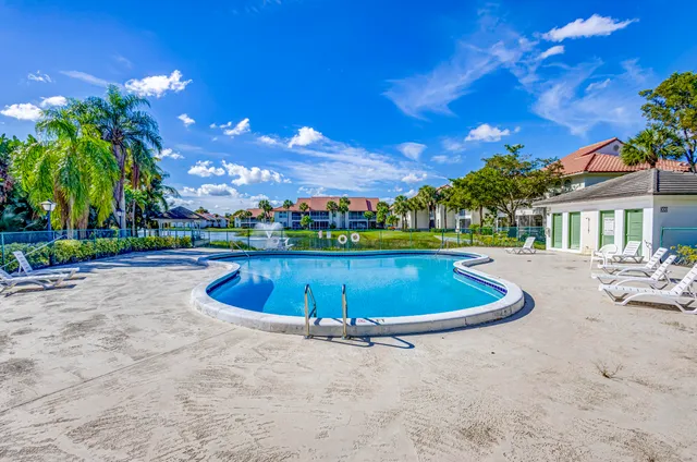 a view of a swimming pool with sitting area