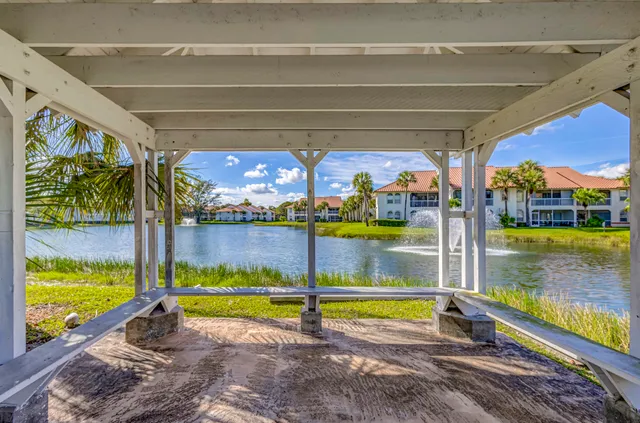 an aerial view of a houses with a lake view