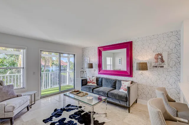 a kitchen with kitchen island a sink cabinets and stainless steel appliances