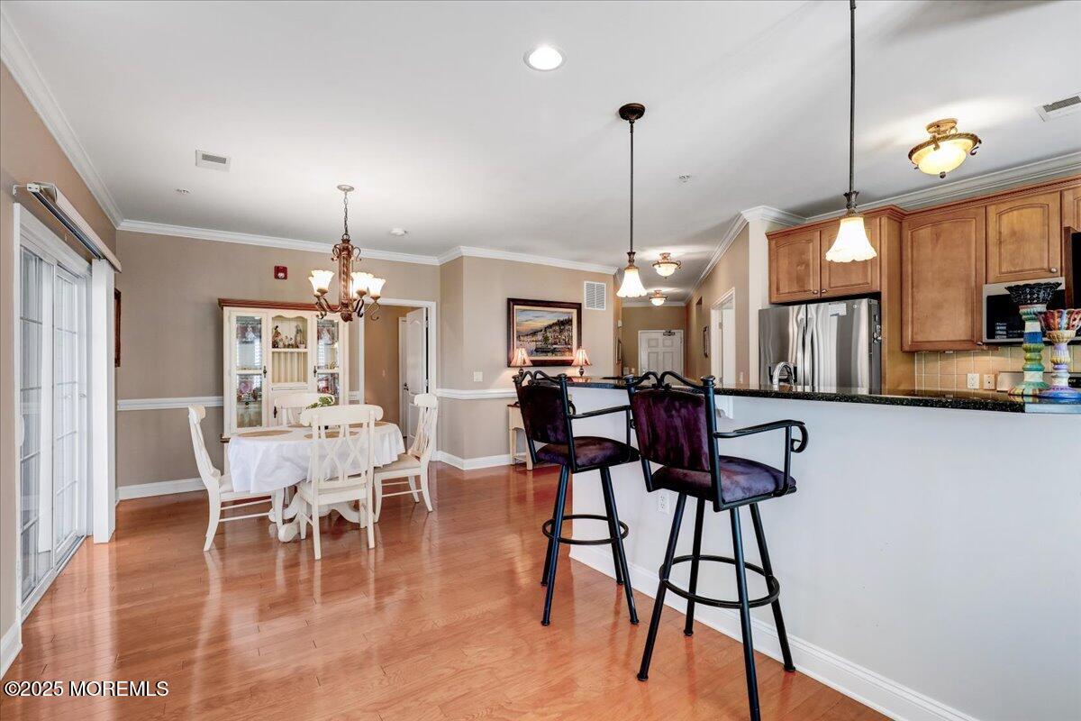 3205 Falston Circle Old Bridge, NJ 08857 - Photo 19 of 44 a view of a dining room with furniture window and wooden floor
