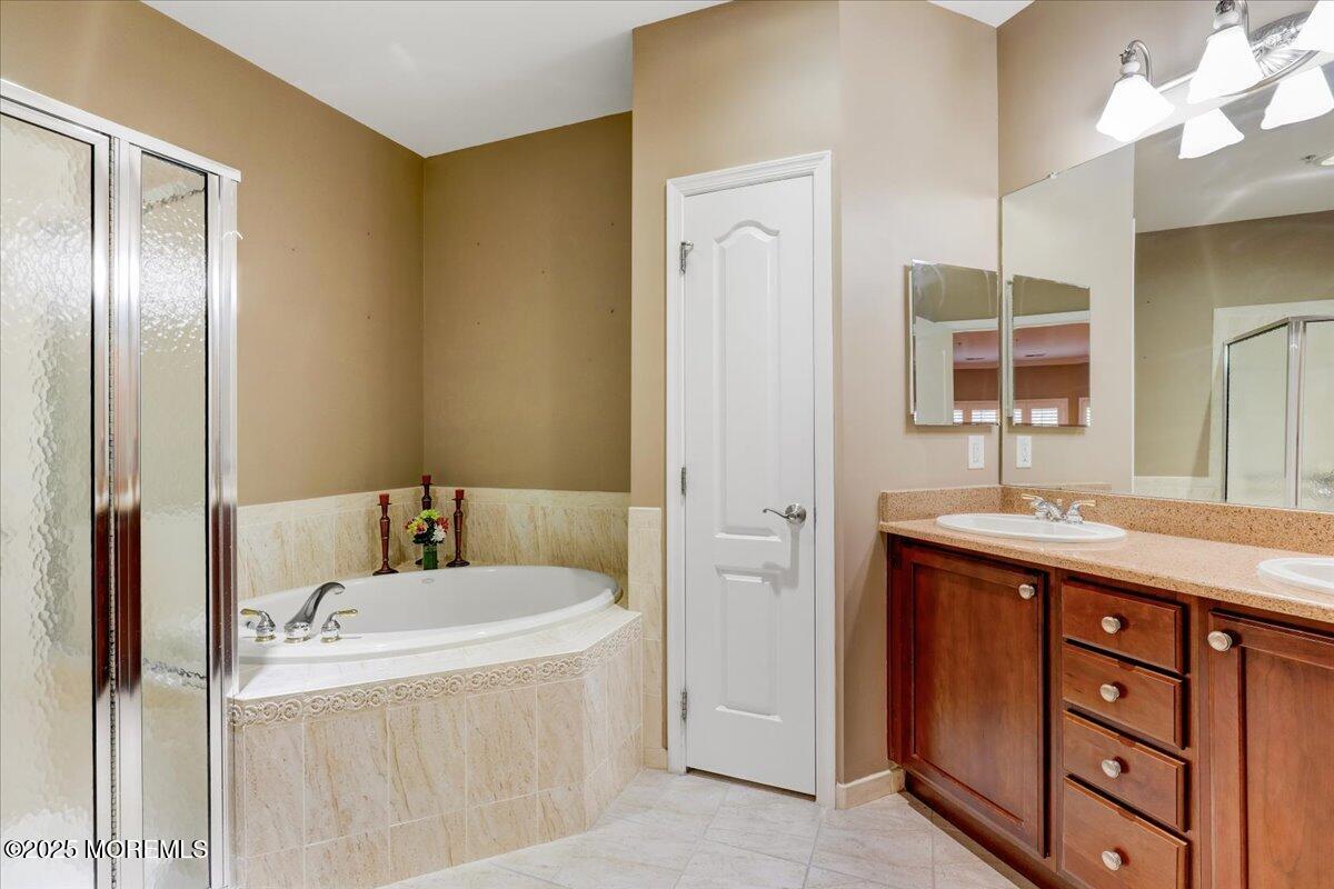3205 Falston Circle Old Bridge, NJ 08857 - Photo 25 of 44 a bathroom with a tub sink and mirror