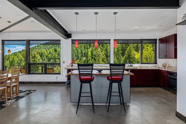 a living room filled with furniture and a large window