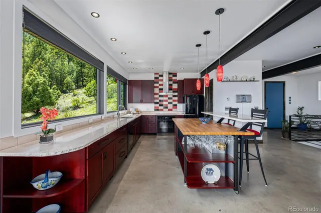 a view of kitchen with furniture and window