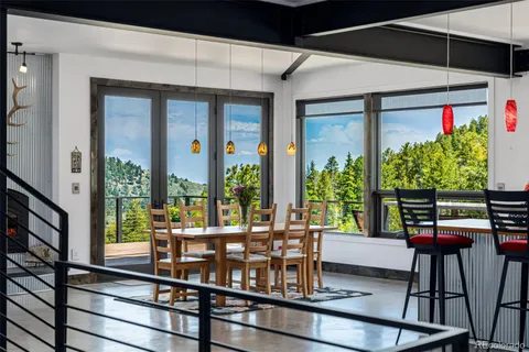 a living room with furniture a bookshelf and a bookshelf