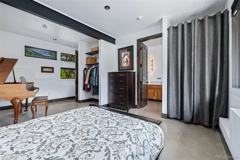 a bathroom with a sink a large mirror and a shower