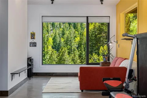 a view of a kitchen with furniture and staircase