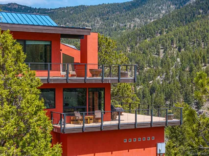 a view of a building with a tree beside it