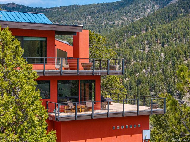 a view of a building with a tree beside it