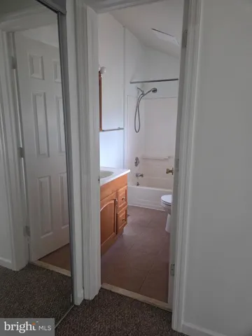 a view of a bathroom from a hallway