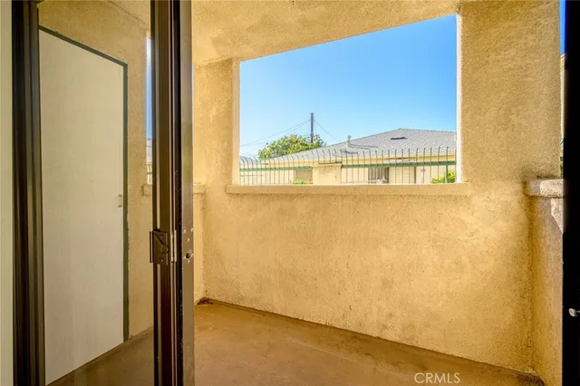 a view of a door and a window